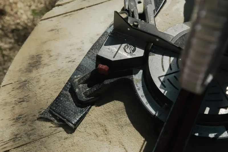 Close-up view of a circular saw on a wooden surface for carpentry and woodworking tasks