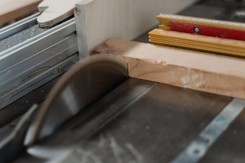 Focused image of a circular saw cutting through timber, highlighting woodworking craftsmanship